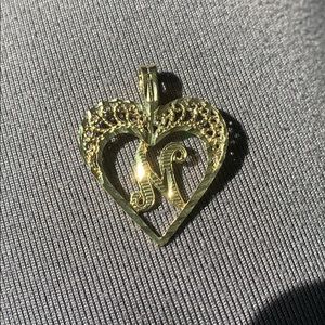 Yellow gold ‘N’heart pendant